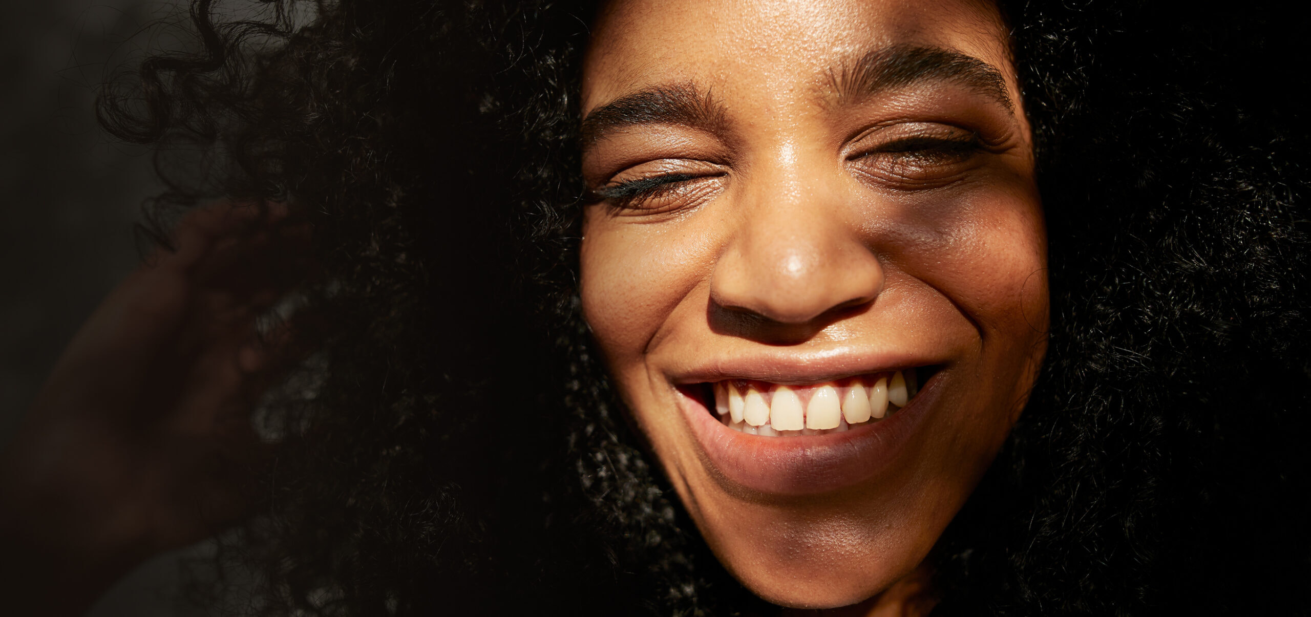 A woman smiling