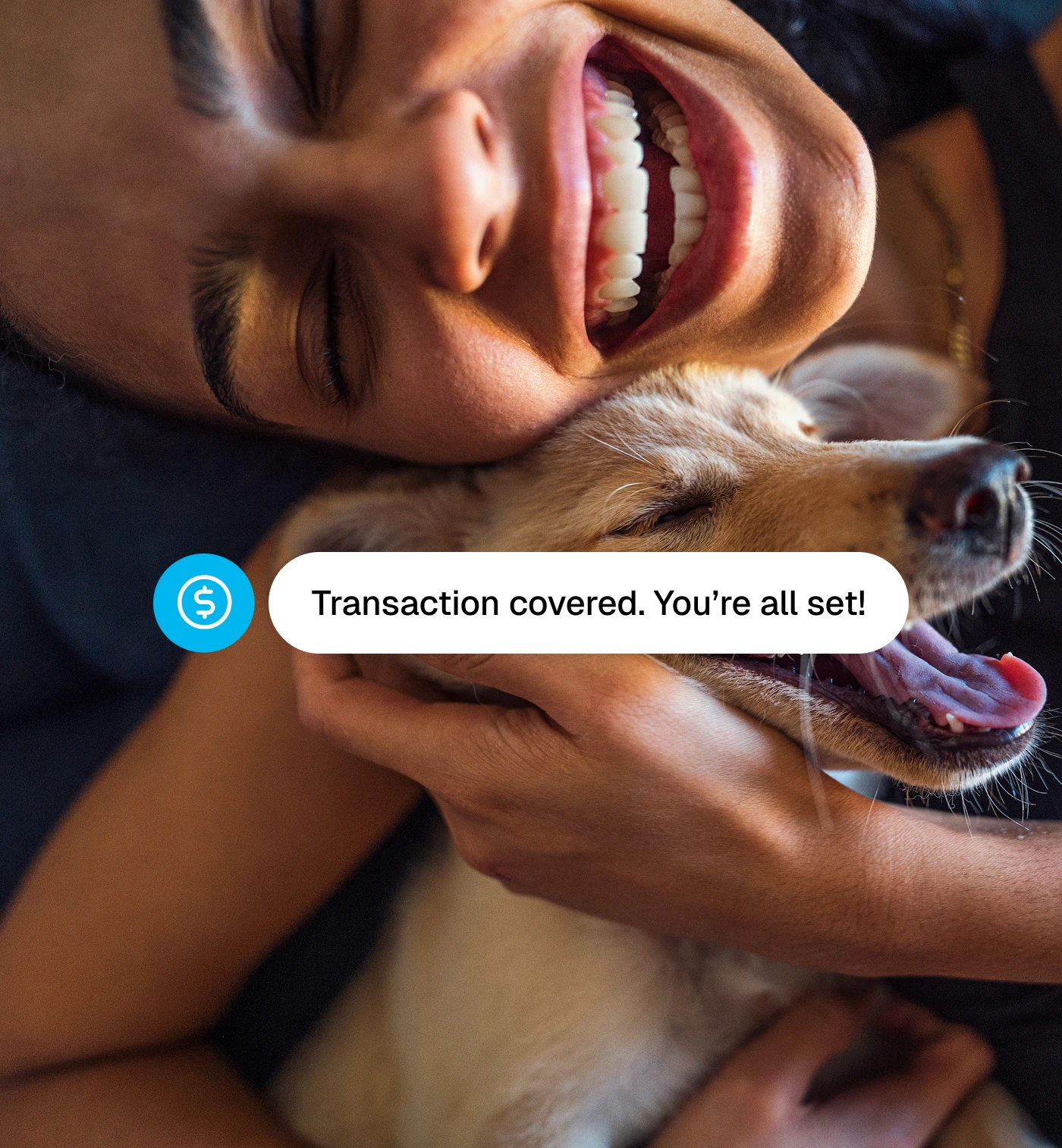 Woman hugging dog smiling with a notification saying "Transaction covered. You're all set!"