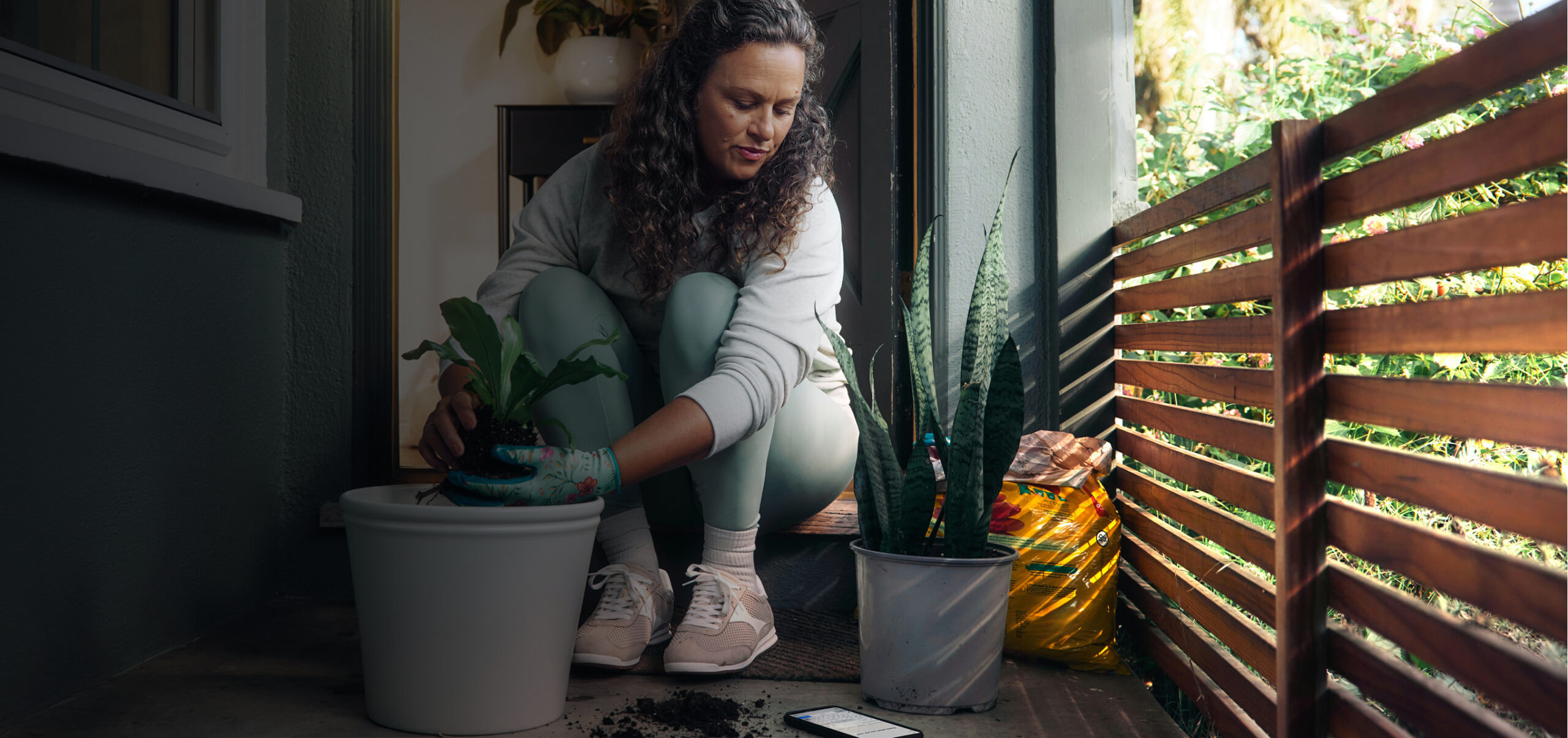 Woman planing planing on her patio.