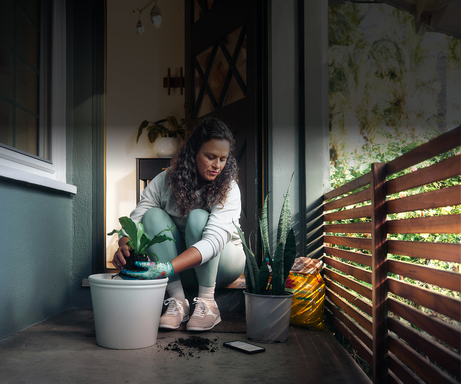 Woman planing planing on her patio.